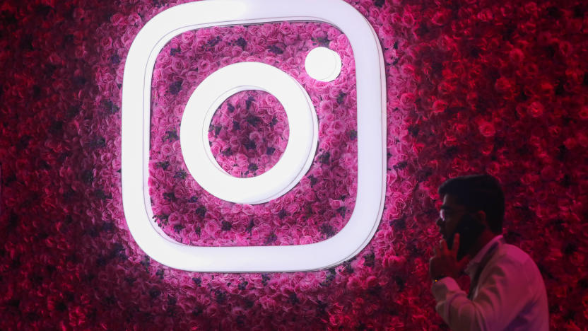 A man talks on the mobile phone next to a logo of Instagram, during a Meta event in Mumbai, India, 20 September, 2023. (Photo by Niharika Kulkarni/NurPhoto via Getty Images)