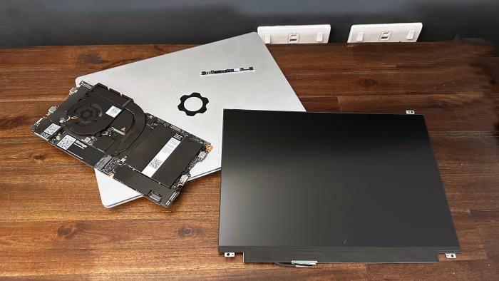 Image of a Framework Laptop 13 and its upgrade components.