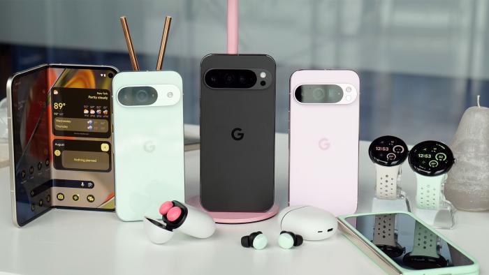 All the hardware announced during Google's annual Pixel hardware event is arranged on a white table and look quite shiny and new in black and pastel hues. 