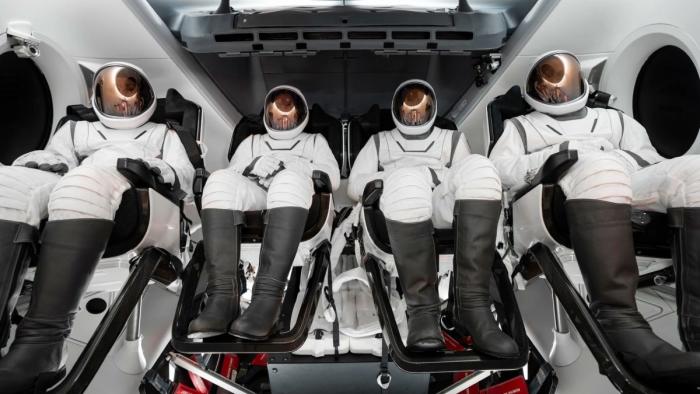 Astronauts in a space vehicle.