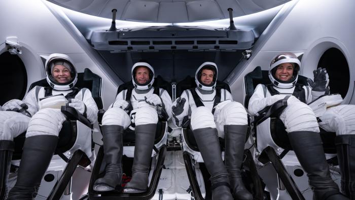 The four Polaris Dawn crew members in their spacesuits in the Dragon capsule during tests ahead of the flight