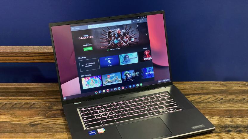 The Acer Chromeboko 516 GE  laptop seen open, facing the camera on a wooden desktop with a blue wall in the background.