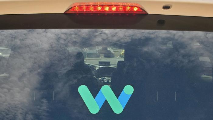 FILE PHOTO: The rear window of a Waymo Chrysler Pacifica robotaxi is seen while parked at a Target store in Tempe, Arizona, U.S., August 31, 2021. Picture taken August 31, 2021. REUTERS/Paresh Dave/File Photo