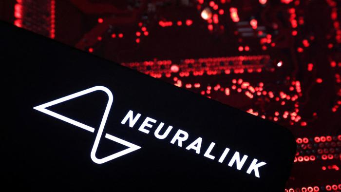 A smartphone with a Neuralink logo displayed is placed on a computer motherboard in this illustration taken on May 15, 2024. REUTERS/Dado Ruvic/Illustration