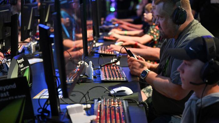 People play video games during Gamescom 2024, a computer and video game industry event, in Cologne, Germany August 22, 2024. REUTERS/Jana Rodenbusch