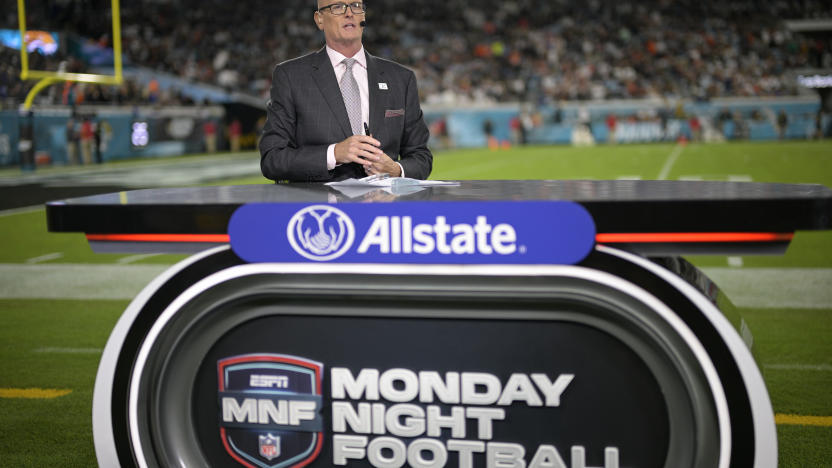 ESPN Monday Night Football host Scott Van Pelt works from the sideline set during halftime of an NFL football game between the Jacksonville Jaguars and the Cincinnati Bengals, Monday, Dec. 4, 2023, in Jacksonville, Fla. (AP Photo/Phelan M. Ebenhack)