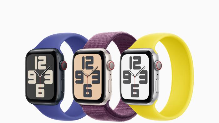 Three second generation Apple Watch SE 2s pictured with a blue, purple and yellow band against a white background